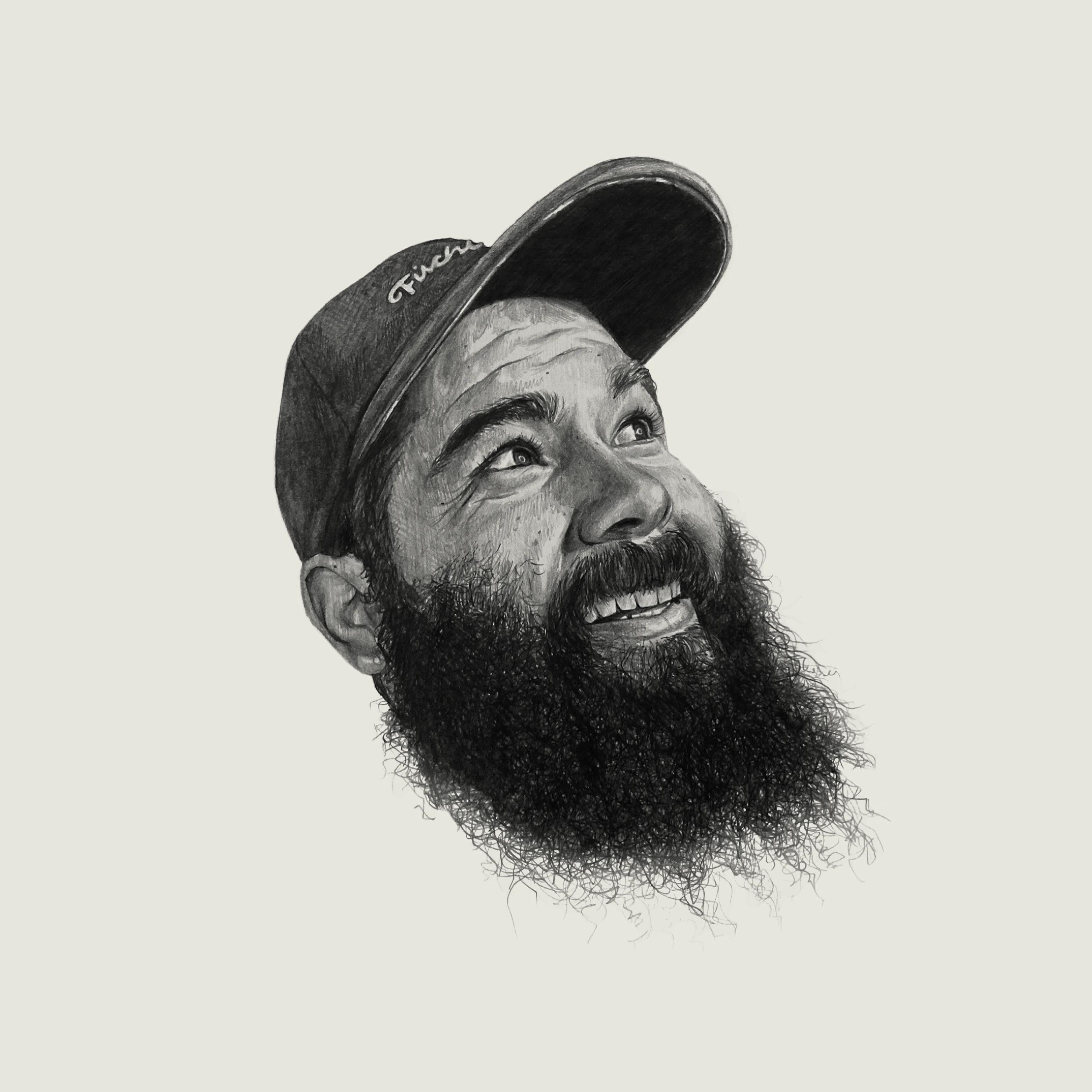 Black and white sketched portrait of smiling Ruben wearing a baseball cap. Ruben has a beard and his eyes are looking up